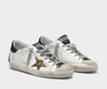Golden Goose Superstar sneakers with gold star and glittery black heel tab
