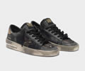 Golden Goose Distressed black and gold Stardan LTD sneakers