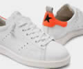 White Starter sneakers with fluorescent orange heel tab Lovers