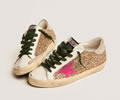 GGDB Super-Star sneakers in gold glitter with fluorescent pink suede star